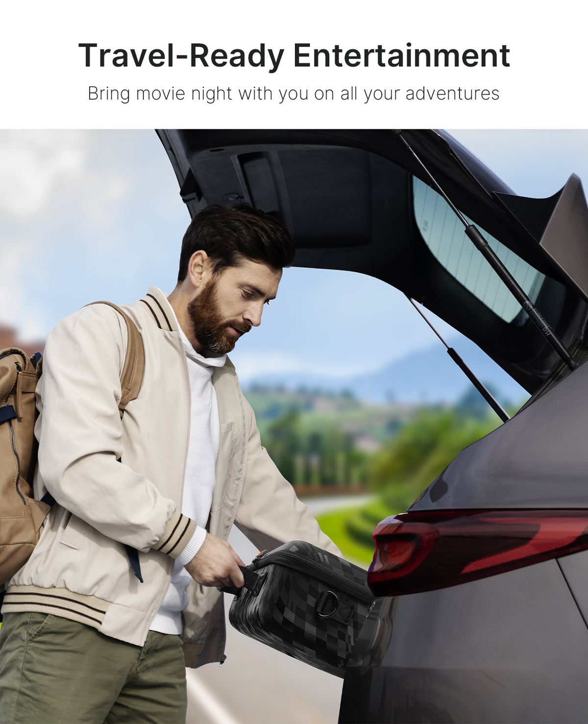 A man preparing for an outdoor trip places the carrying case into the trunk.
