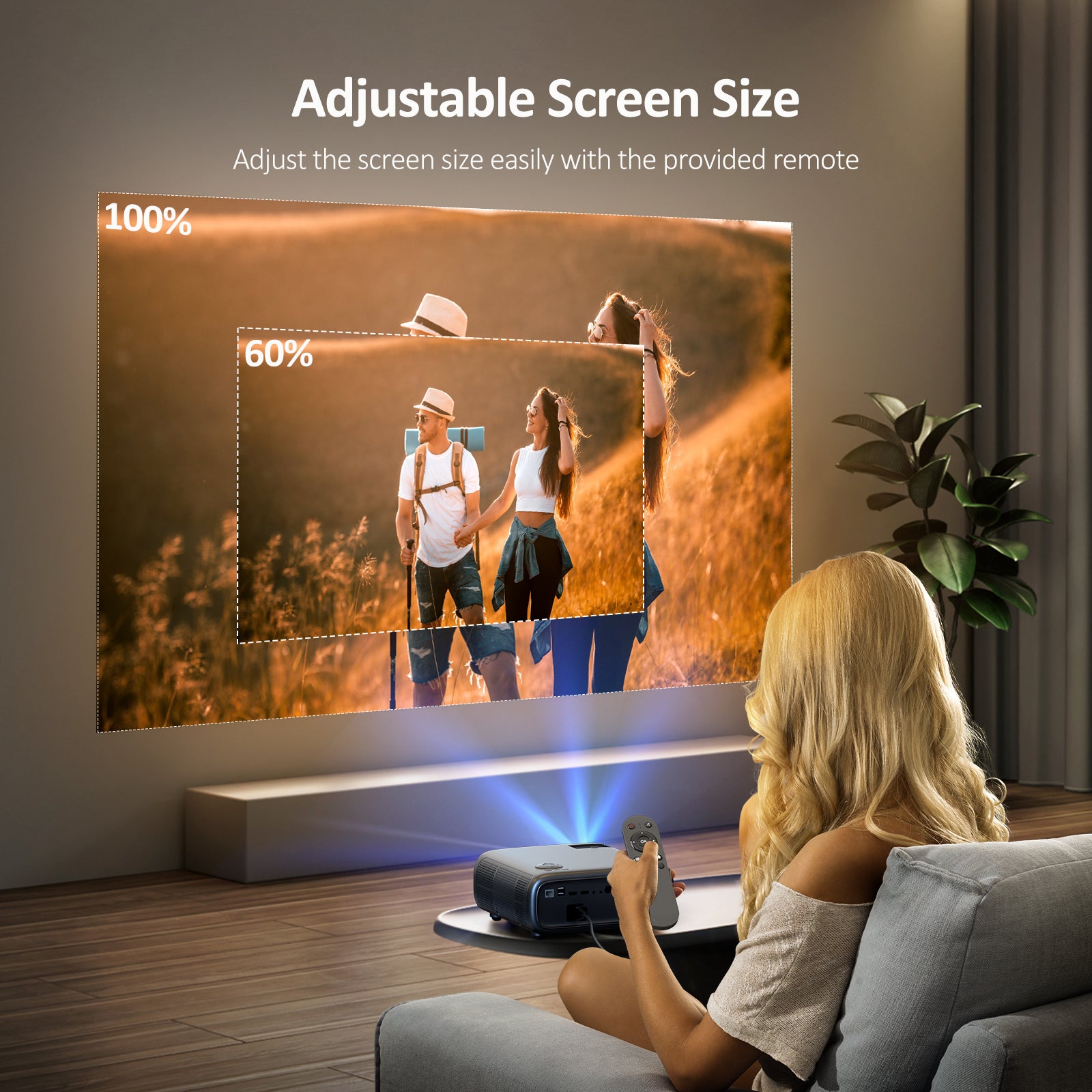 Woman adjusting projector screen size in living room with remote.