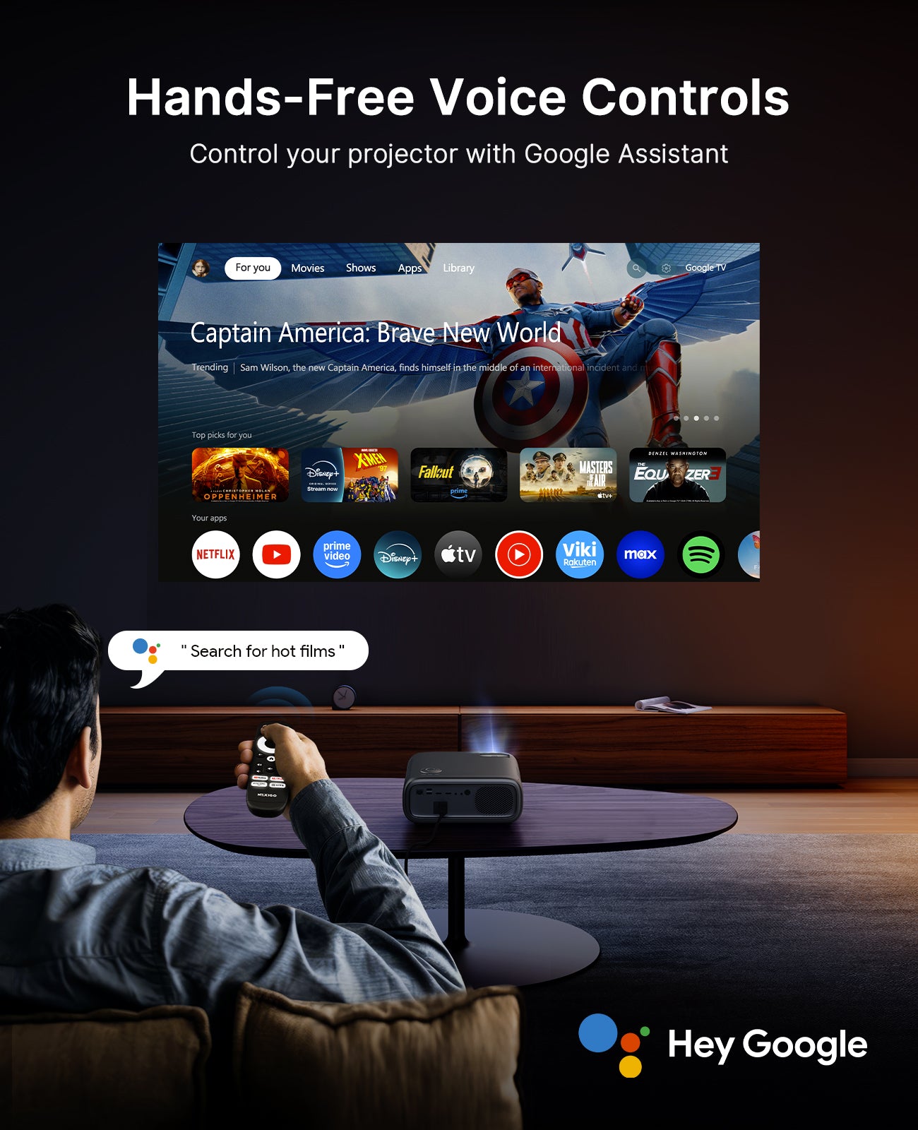A person is sitting on the sofa while Google Assistant is playing a movie.