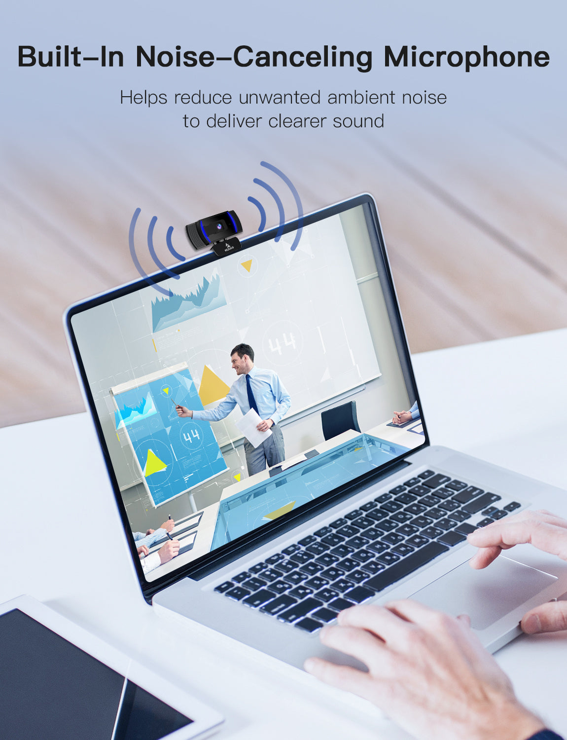 Webcam with built-in noise-canceling microphone, placed on laptop for clear video conferences.