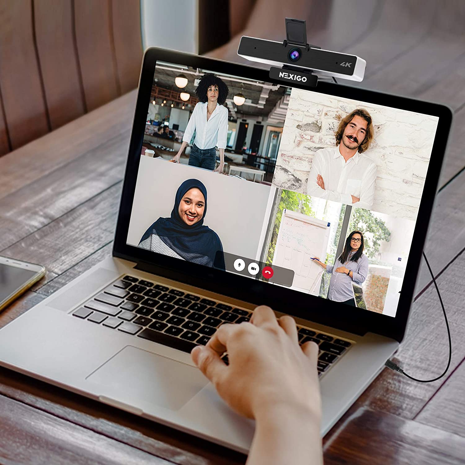 A person is using a 4K webcam for a multi-person video conference.