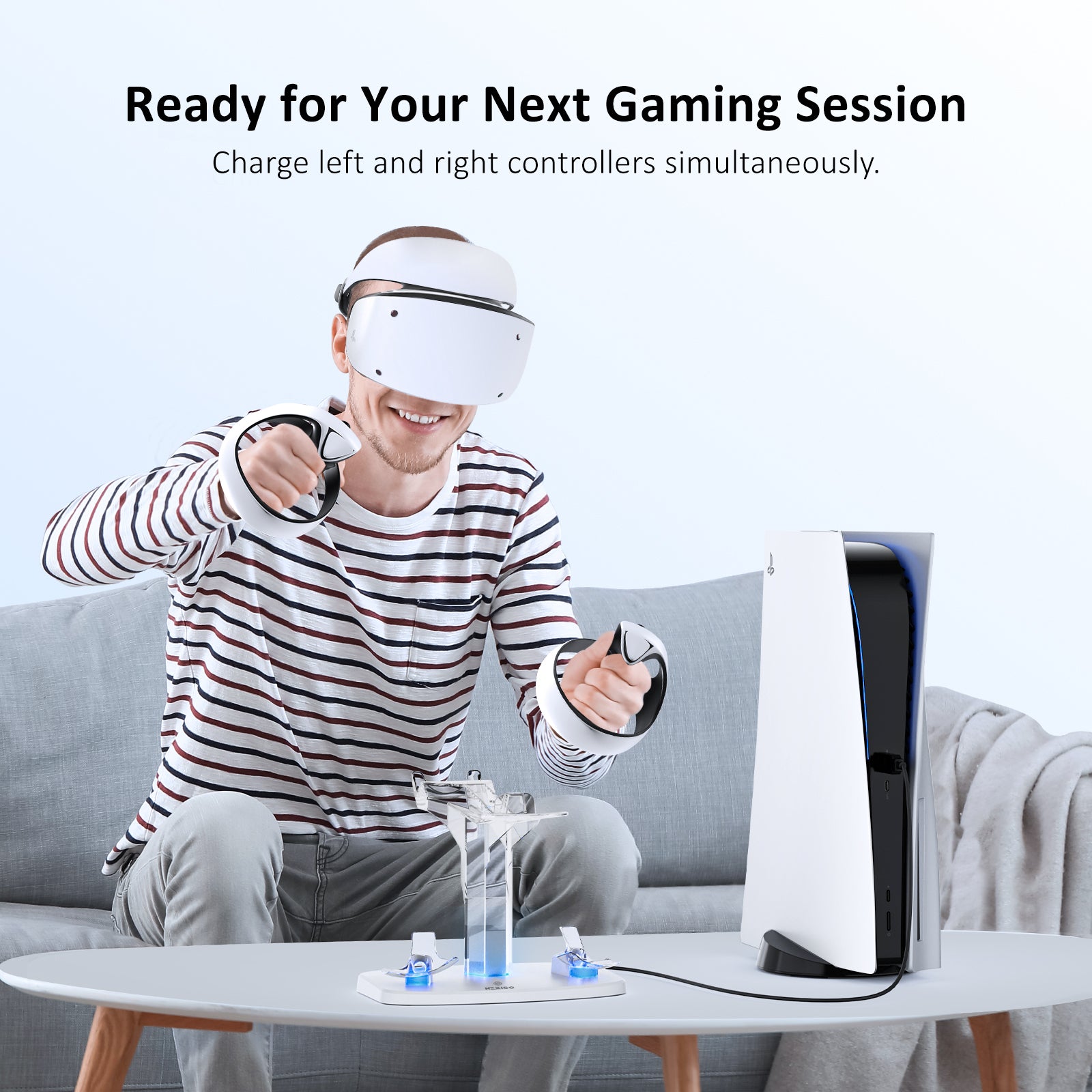 A person playing PS5 VR2 in the living room with the Charging Station