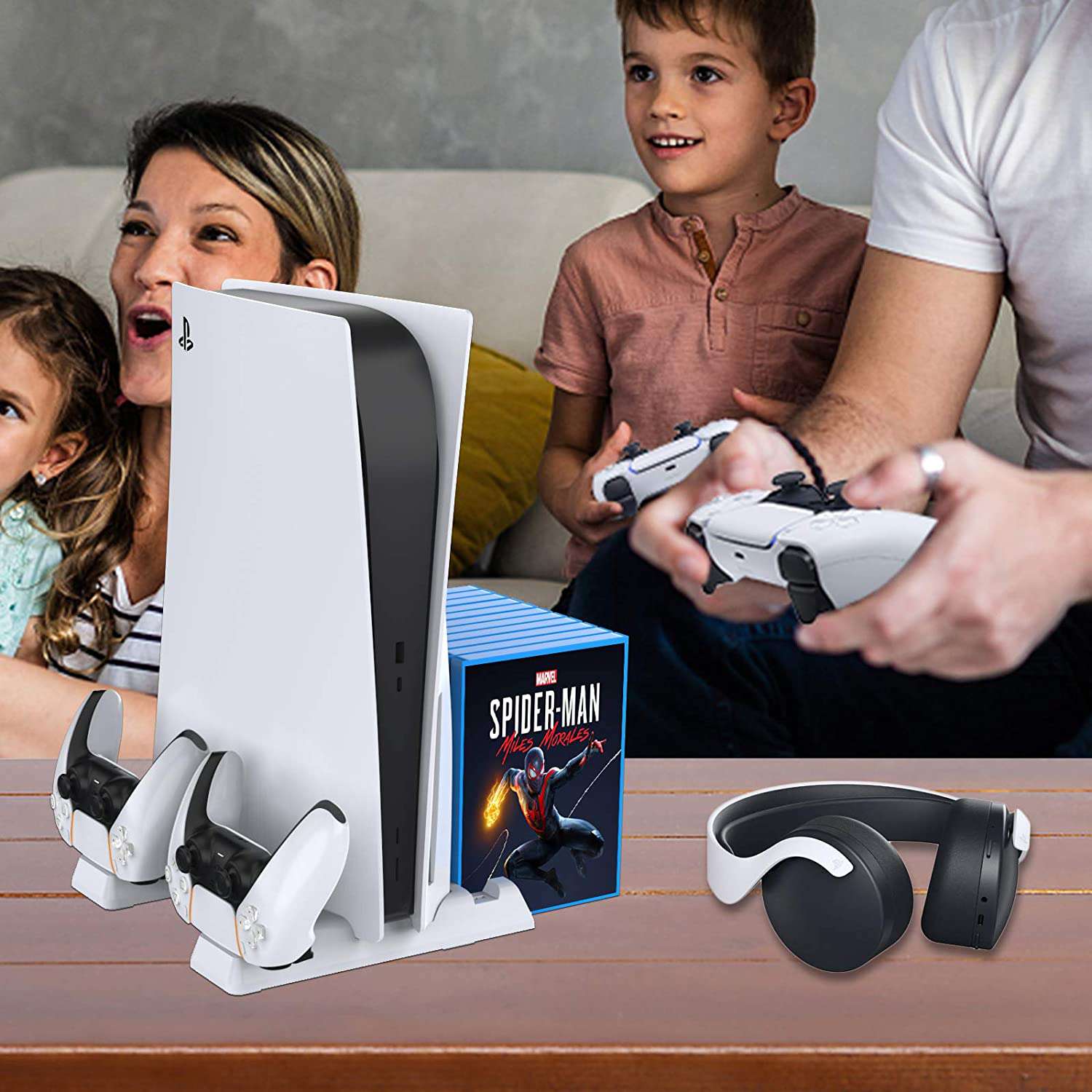 A family of four enjoying gaming with the PS5 on the PS5 Stand Vertical.